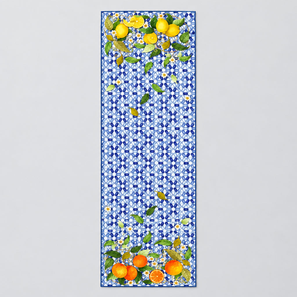 Decorative tablecloth with floral and fruit pattern on a blue geometric background